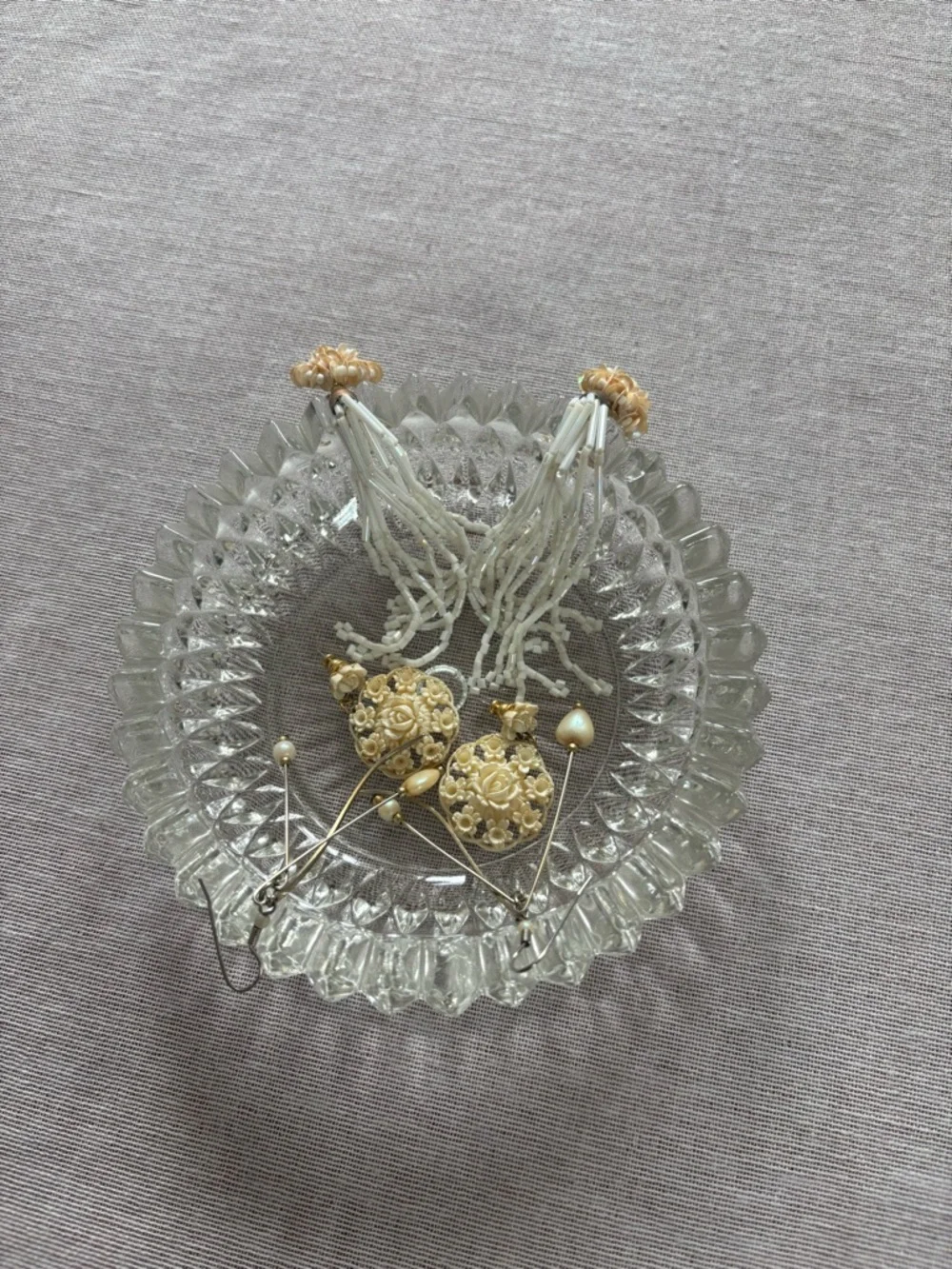 Set of three vintage cream earrings.